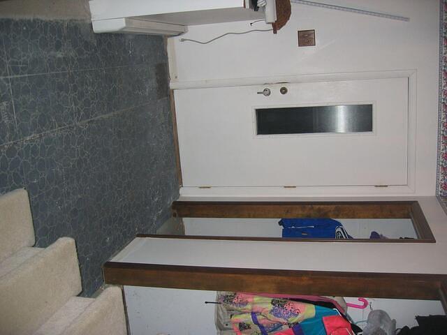 Day 2, tile is removed from the rest of the area, finding lovely linoleum underneath.