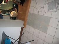 An example of the tile situation that spawned this whole project.  Tile was put down over particle board by prior owner, and 30-40% of it loose/cracked