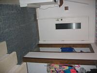 Day 2, tile is removed from the rest of the area, finding lovely linoleum underneath.